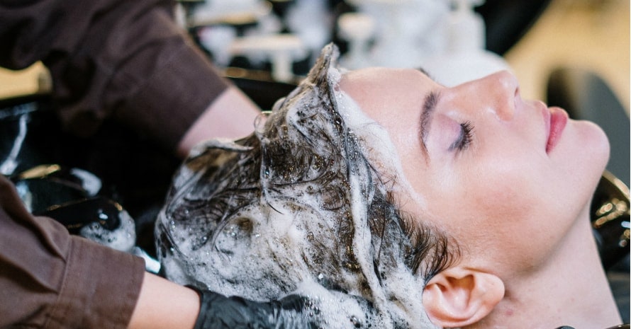 person-washing-woman-s-hair